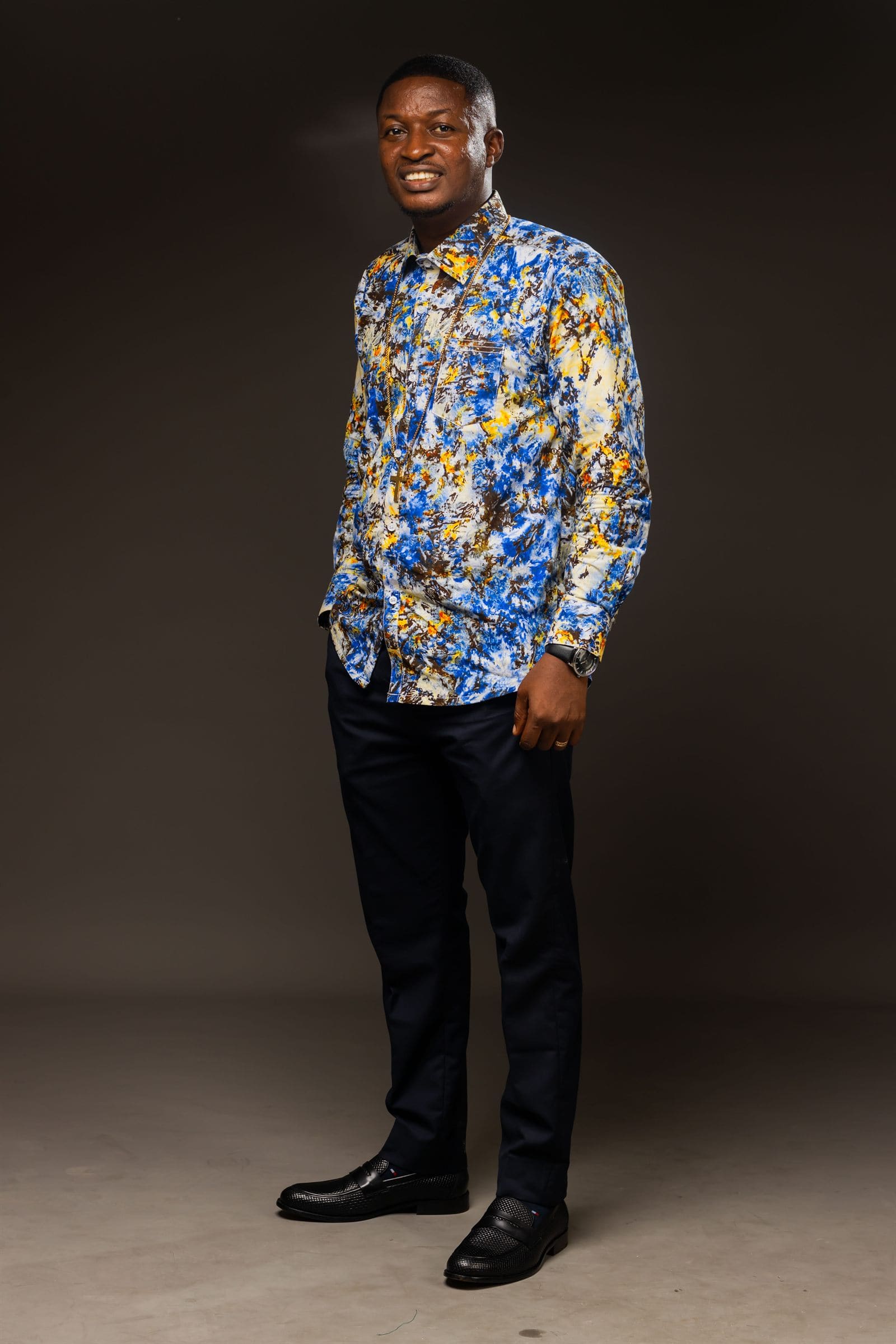 Minister Theophilus Badger in vibrant patterned shirt
