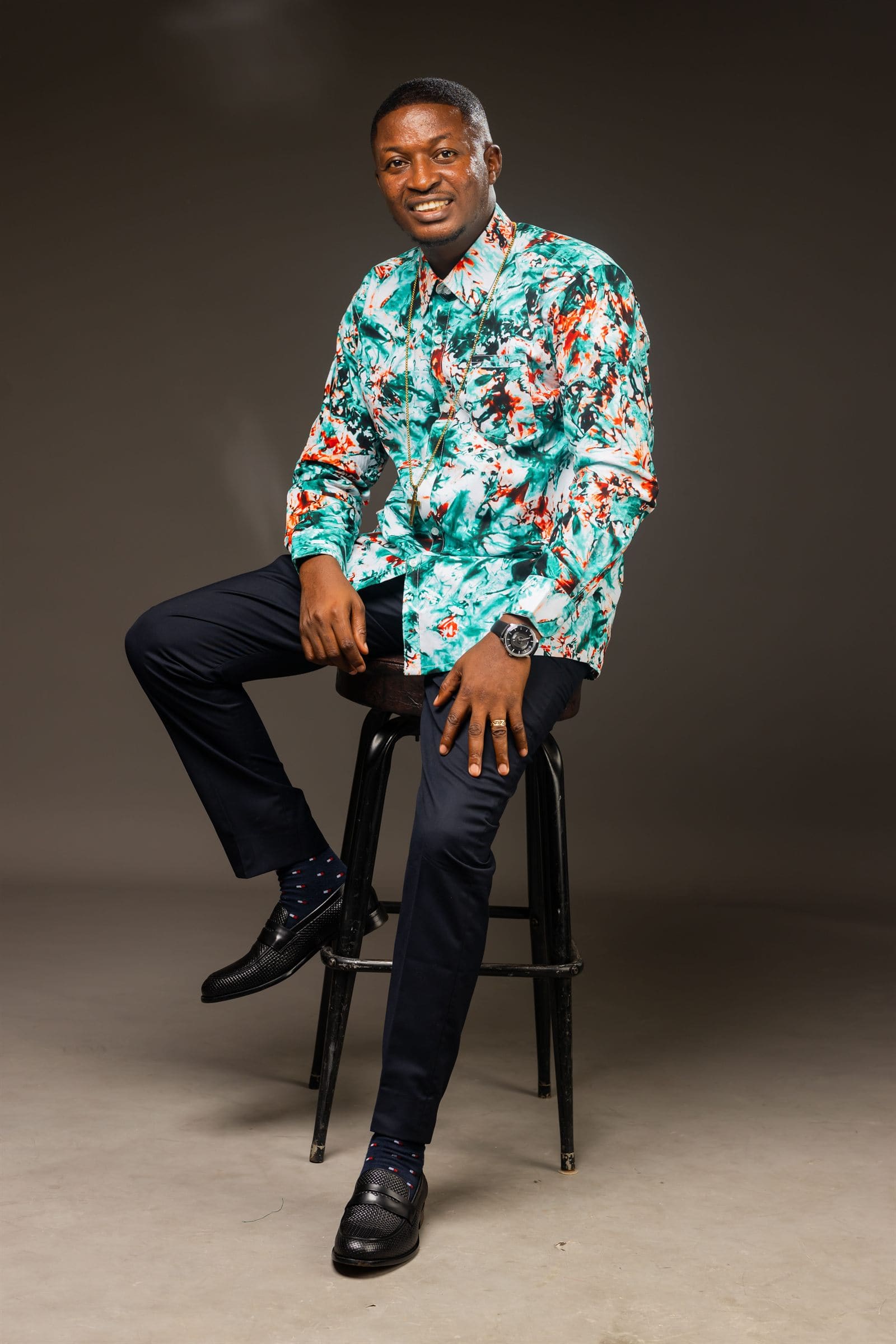 Minister Theophilus Badger in colorful casual shirt
