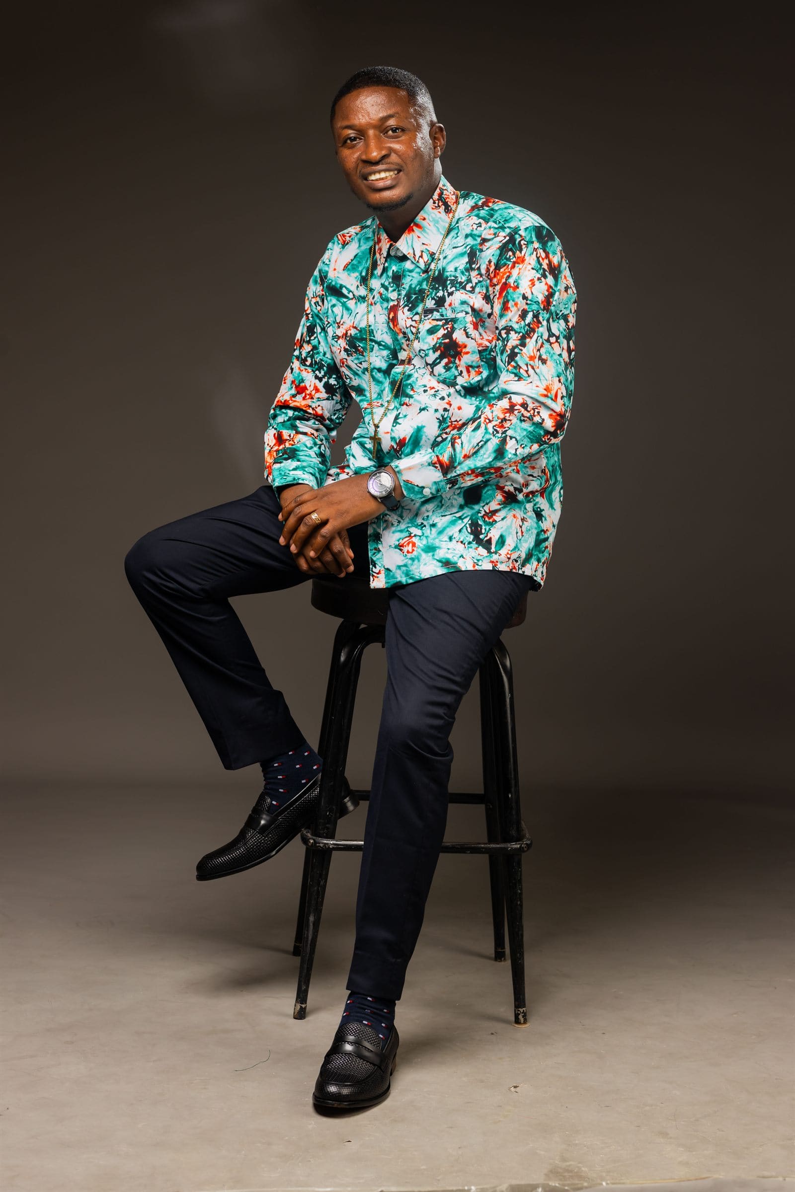 Minister Theophilus Badger in patterned shirt